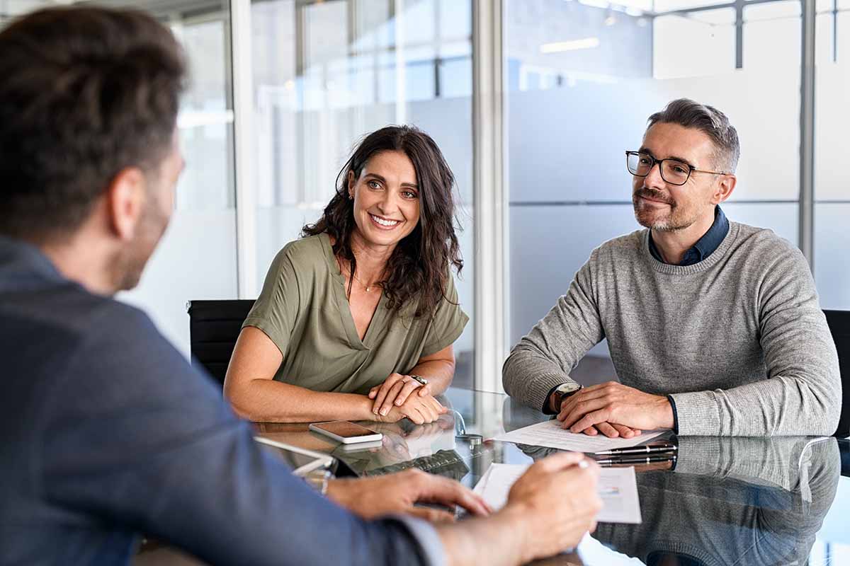 couple meeting with representative regarding their online installment loan