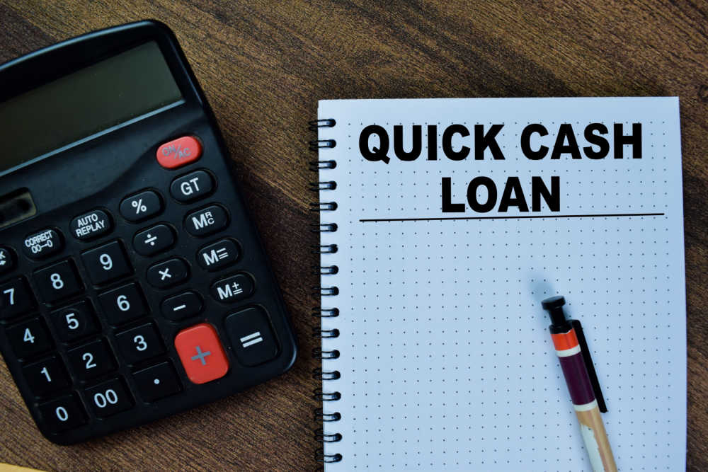 quick cash loan wriiten in book and calculator