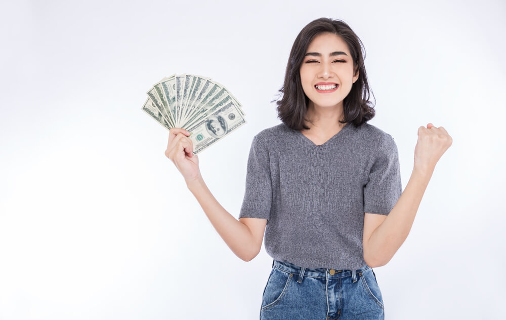 Woman with cash from automobile title loan