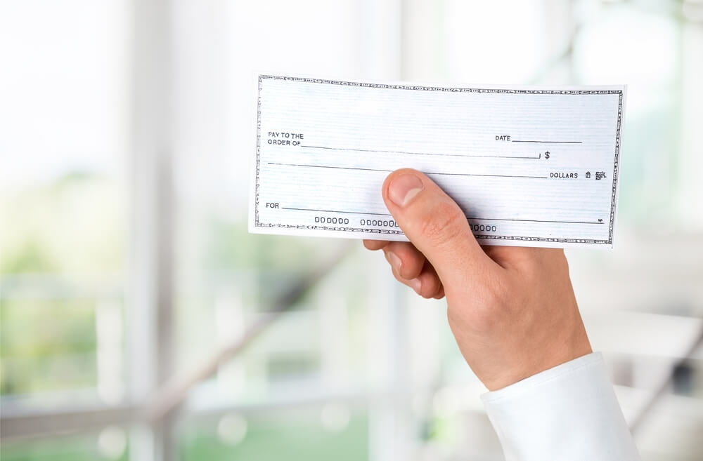 man holding a check