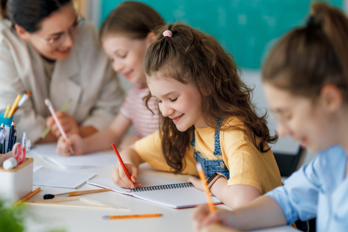 little girl back to school with new supplies