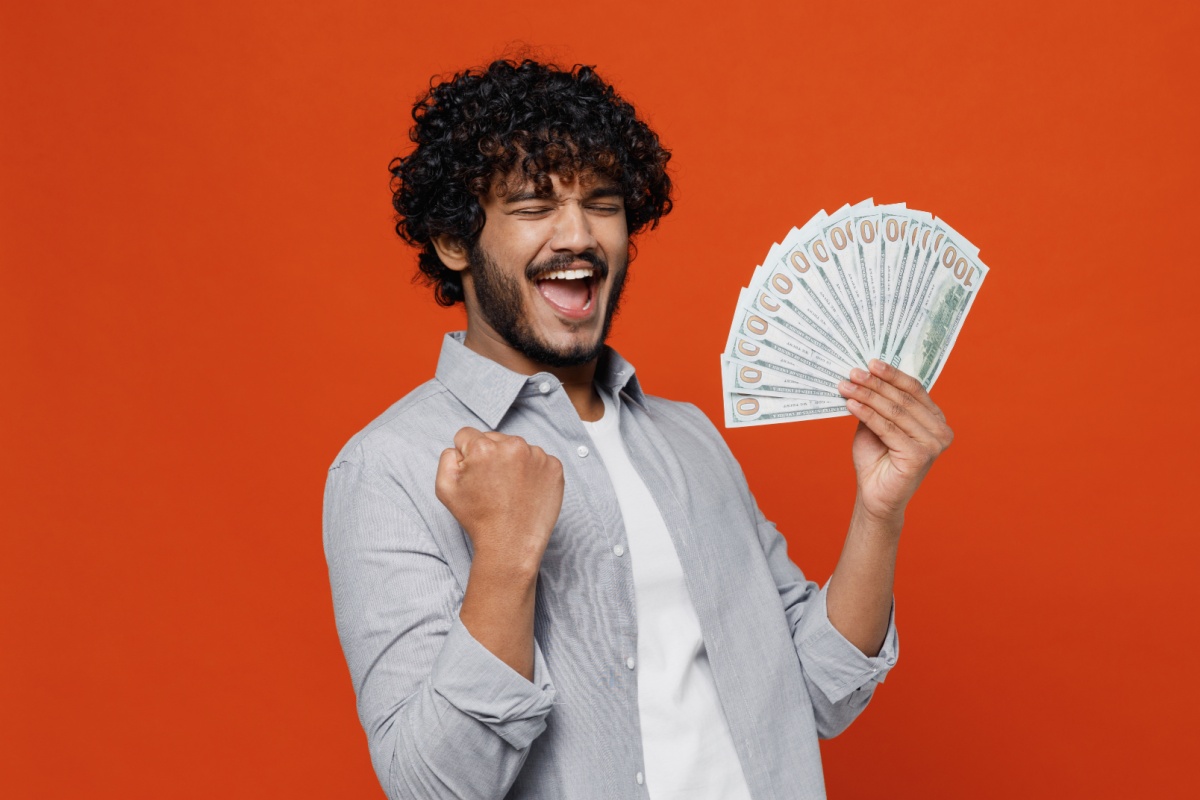 man celebrates with title loan cash