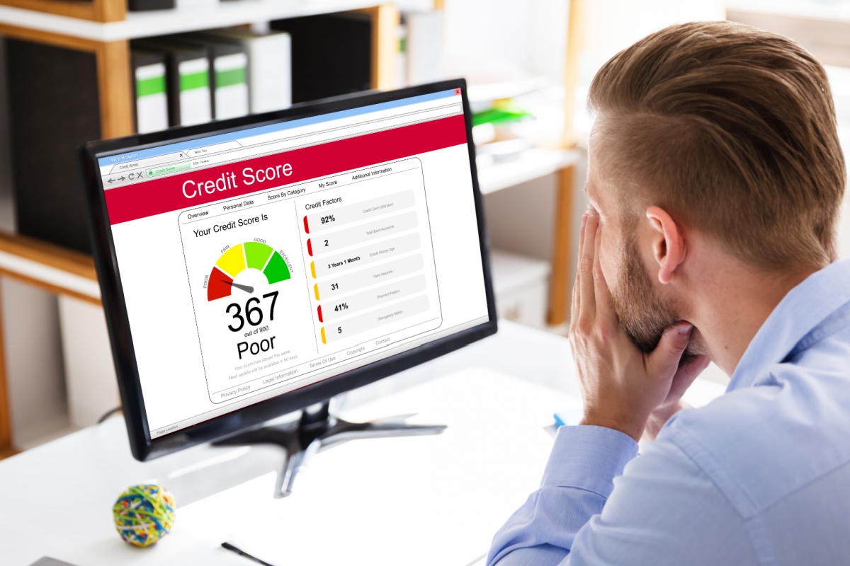 man checks bad credit score online