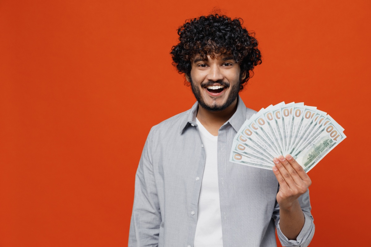 man holds title loan cash for utility bill help SC