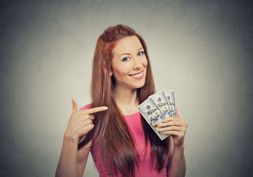 woman happy with payday loan cash