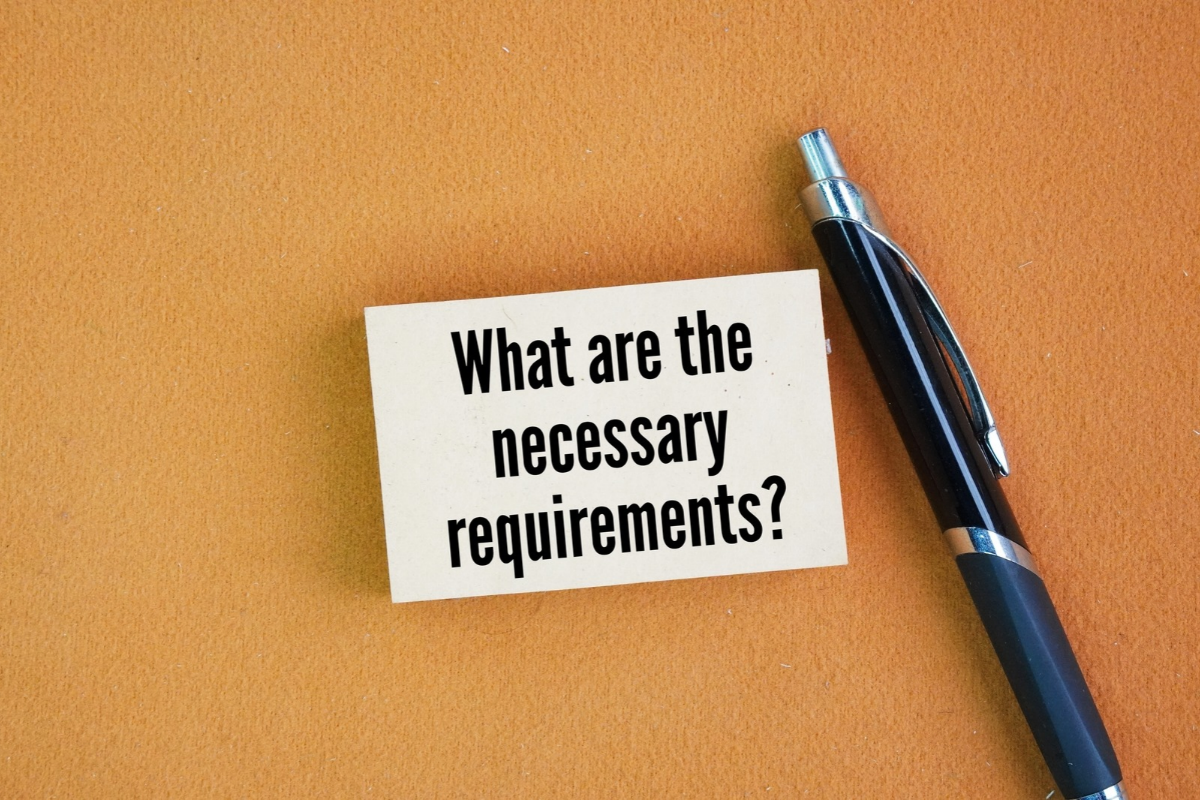 pen with note that says what are the necessary requirements
