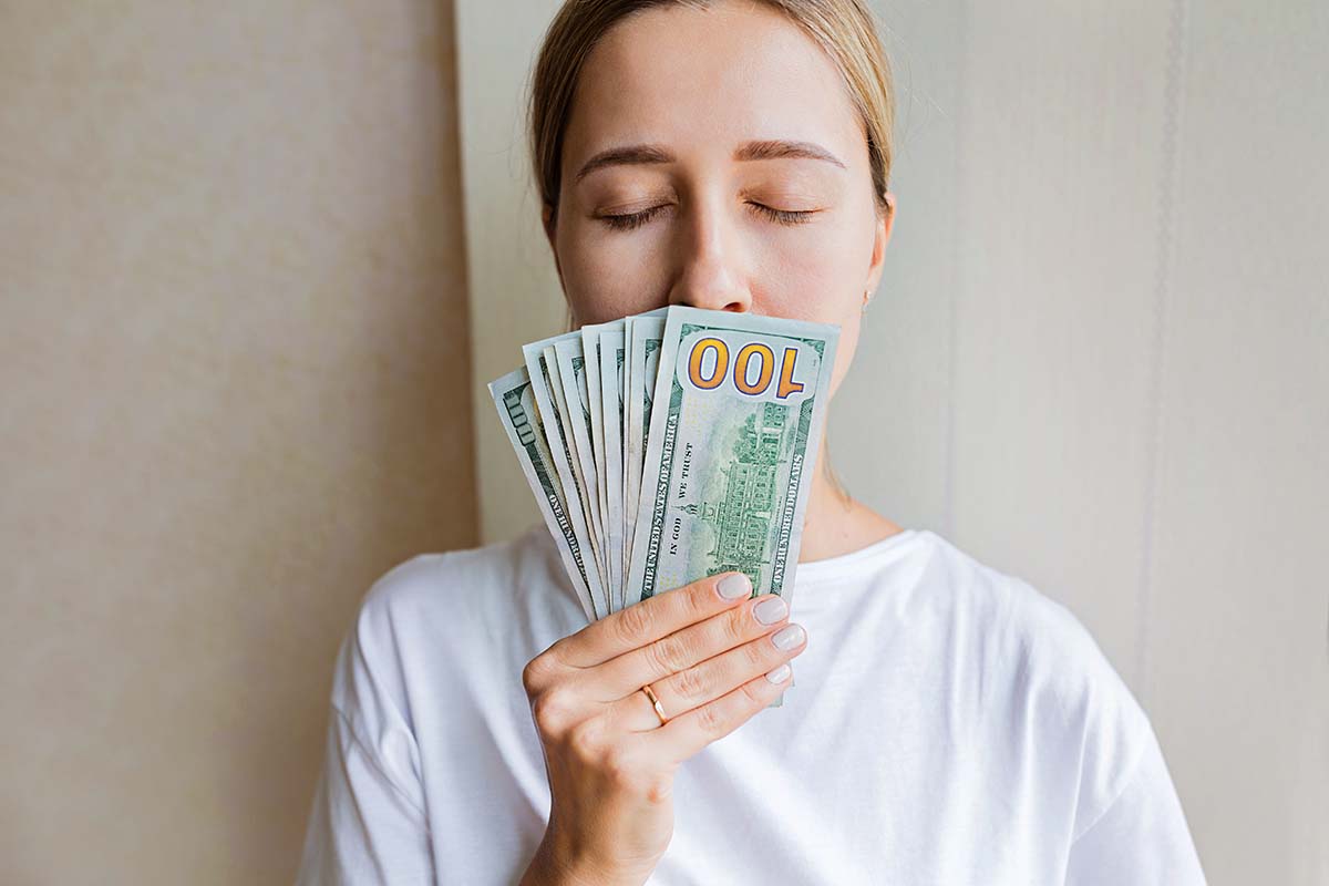 woman with money from title loan