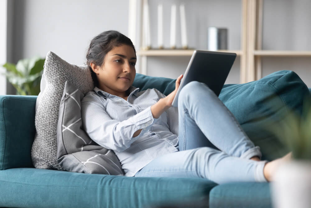 woman applying for online car title loan from home