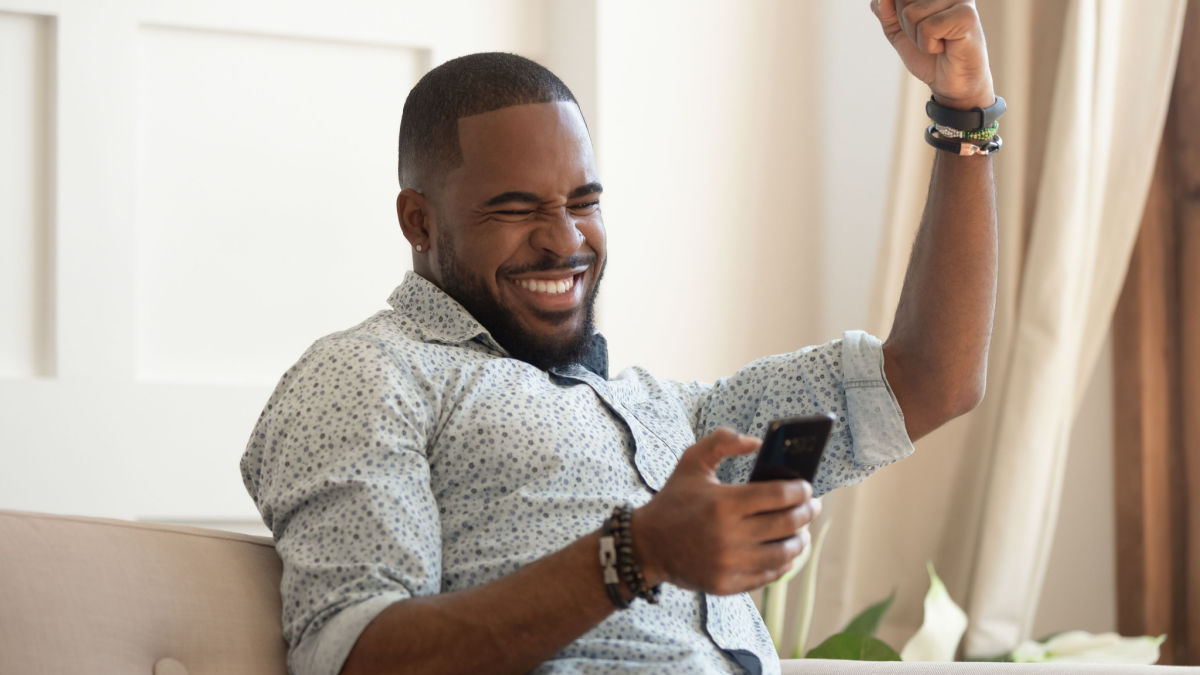 man excited about improving long term finances