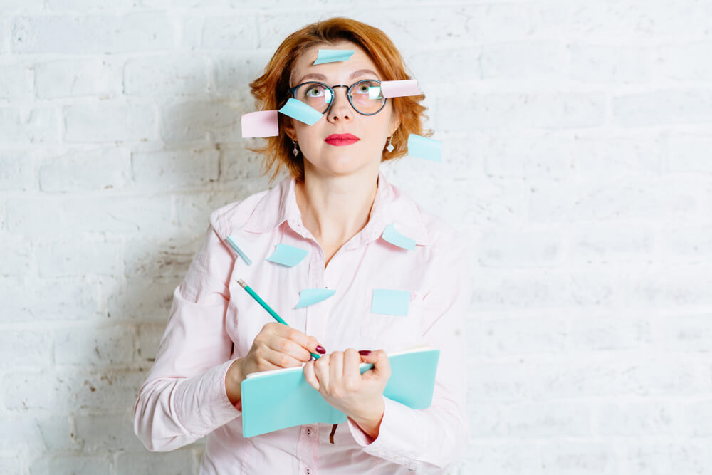 woman writing notes about Prescott Valley title loans