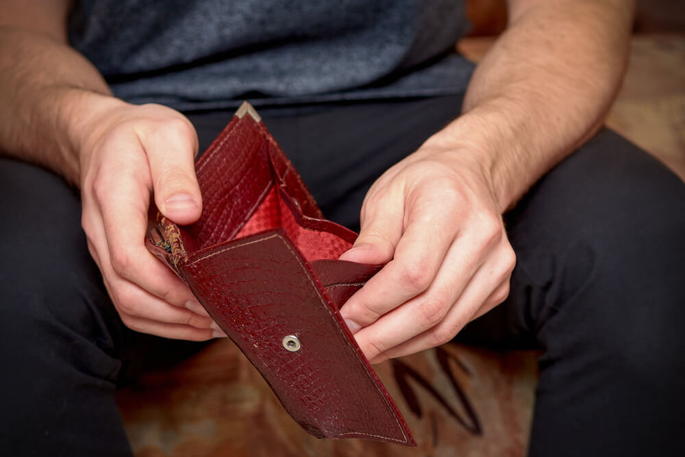 man with empty wallet