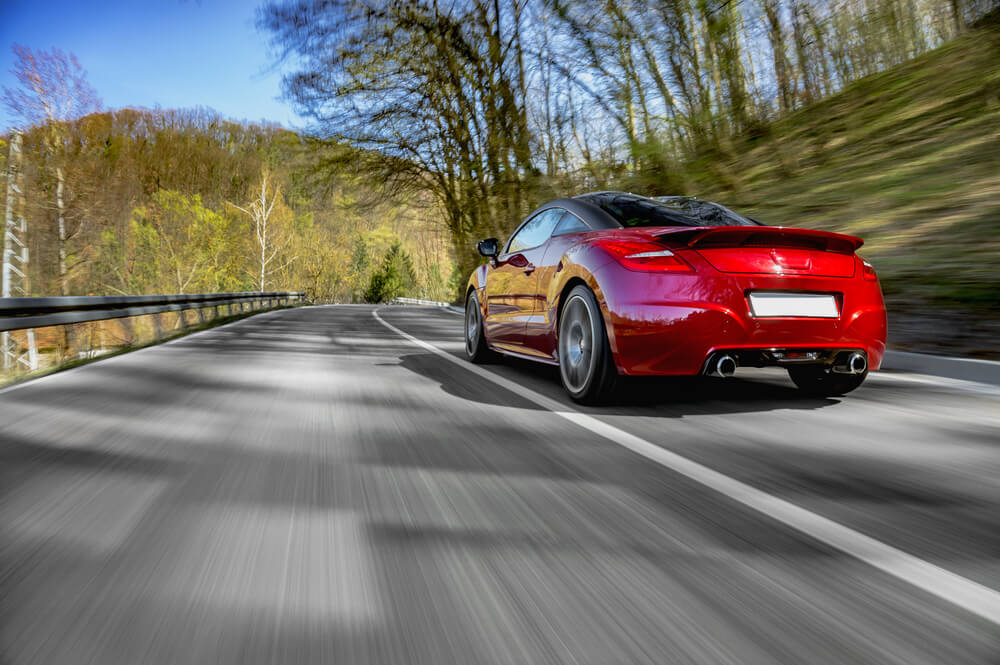 car driving on mountain road