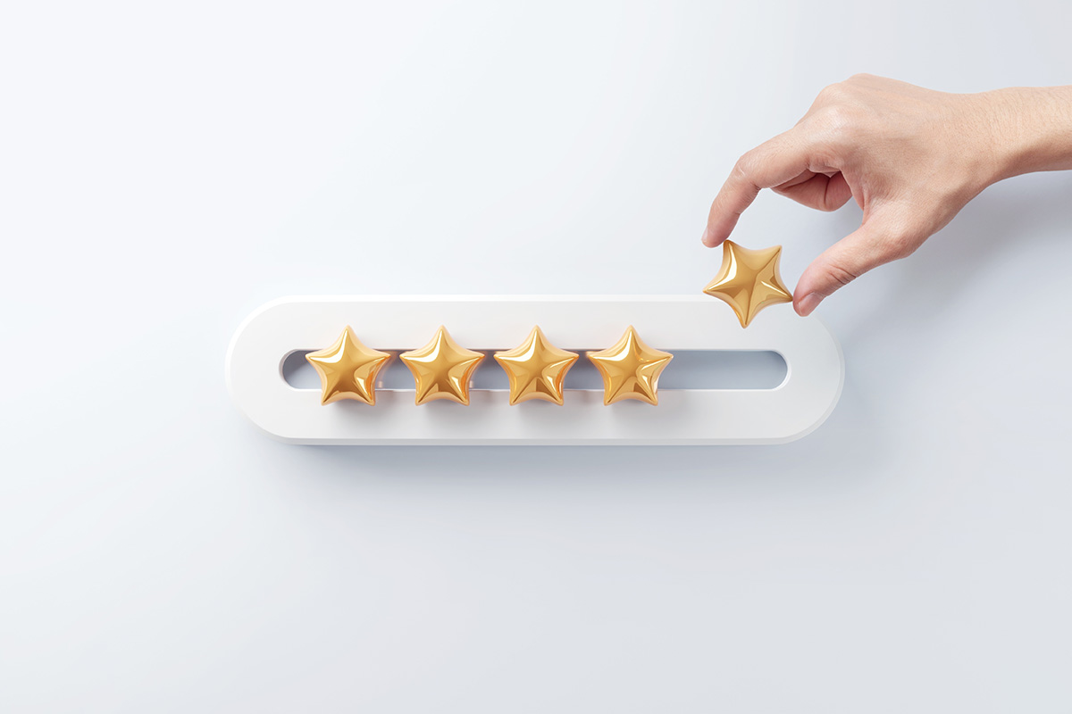 Star reviews for a title loan company, featuring 5 golden stars and a hand holding one of them.