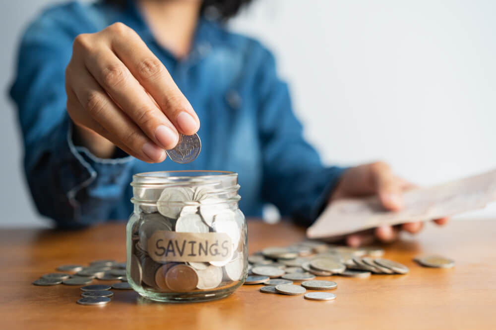 woman adding to her emergency fund