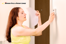 woman adjusts thermostat and leads to NV high energy bill