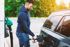 man fills his gas tank