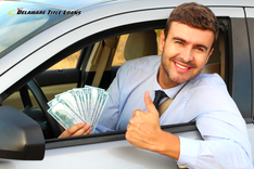 happy man holds title loan cash outside car window