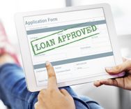 person being approved on tablet for installment loans in las vegas