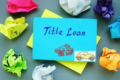 balled up sticky notes and one sticky note that reads title loan