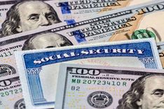 payday loan cash and social security card on table