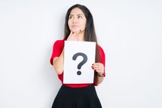 woman holding question mark on a piece of paper for thinking about a fast installment loan