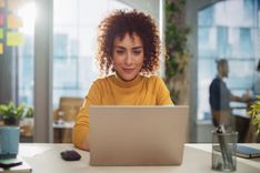 woman researches financial planning tips on her computer