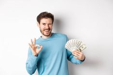 man that is giving okay hand gesture from receiving fast installment loan cash