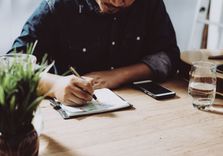 Man sitting his desk applying for installment loan in NV