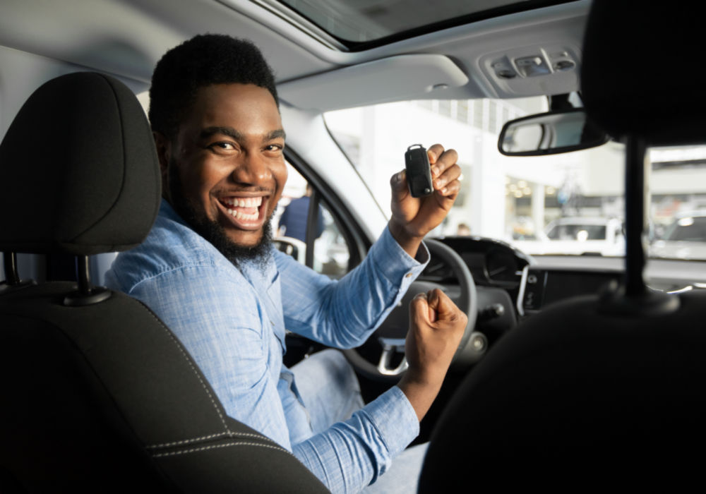 man in car getting title loan