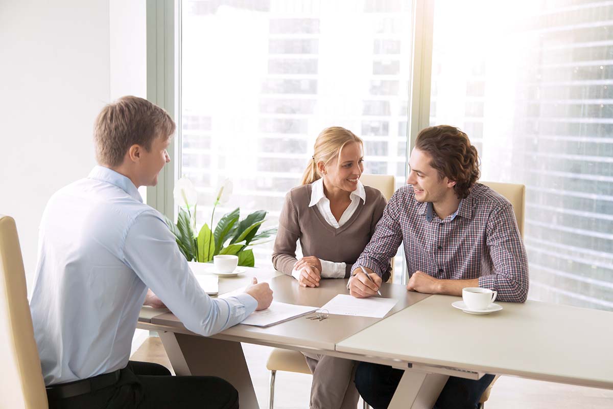 couple in title loan meeting with representative