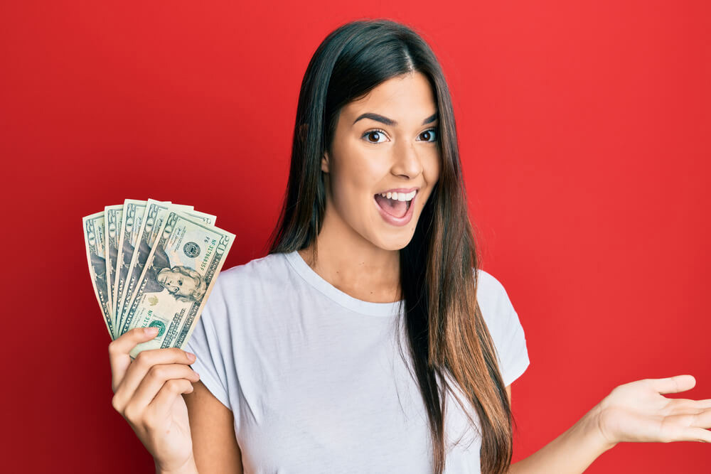 woman happily surprised with title loan money