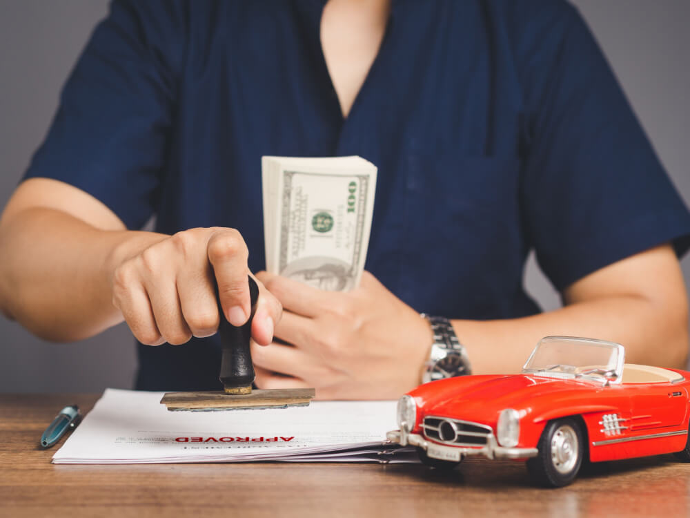 person with money from car title loan