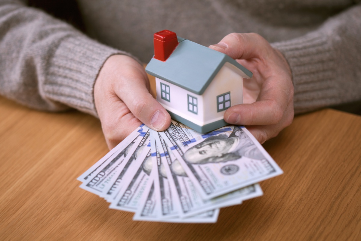 toy house with money from emergency eviction loans