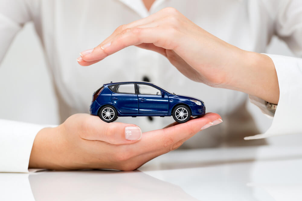 woman holding a toy car for title loans