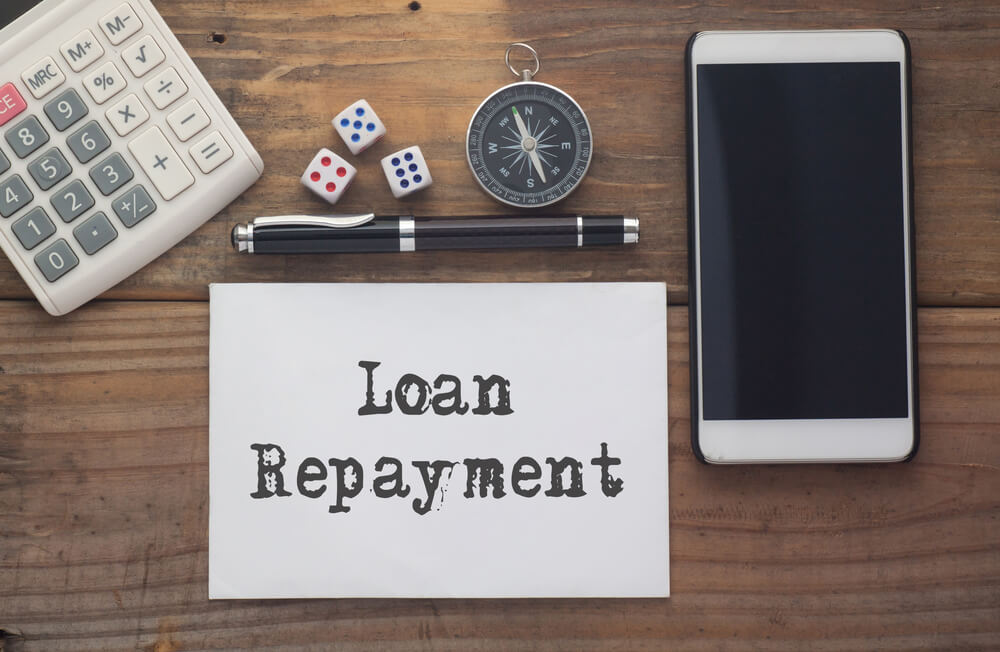 loan repayment written on paper