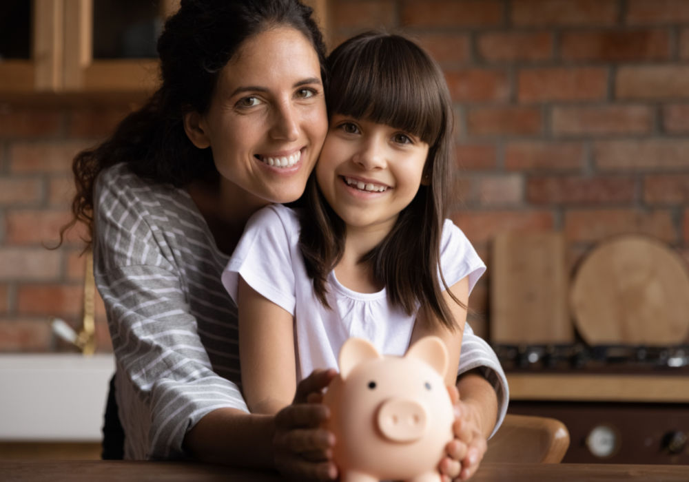 mom and daughter saving money