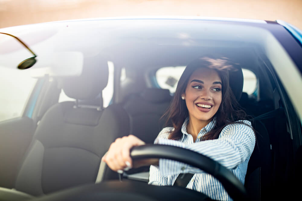 woman driving to auto title loans location near her