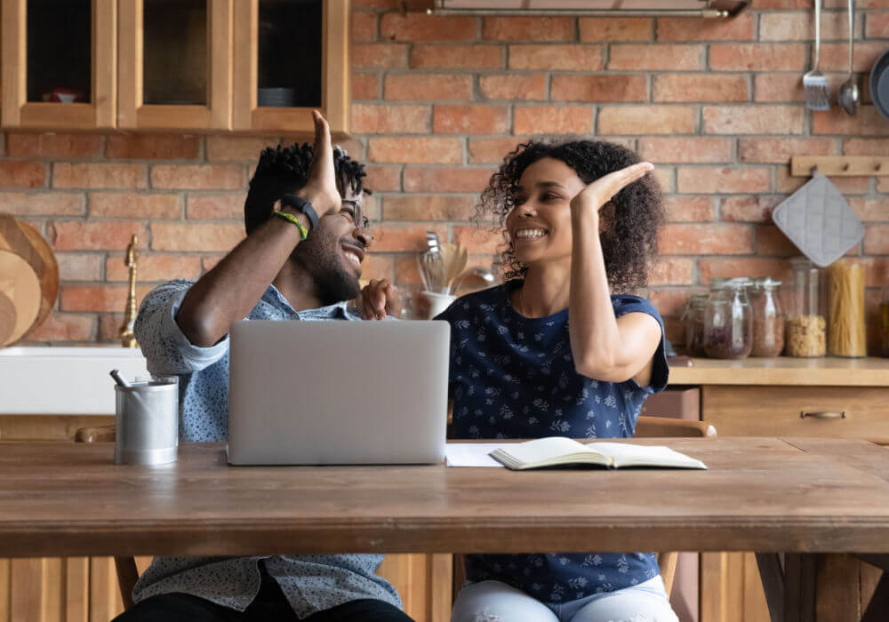 couple celebrating over Delaware car title loan approval