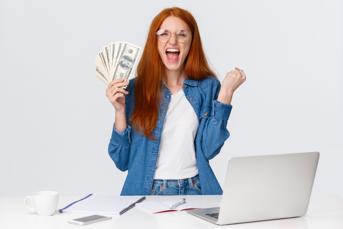 woman celebrates with cash from Las Vegas loan