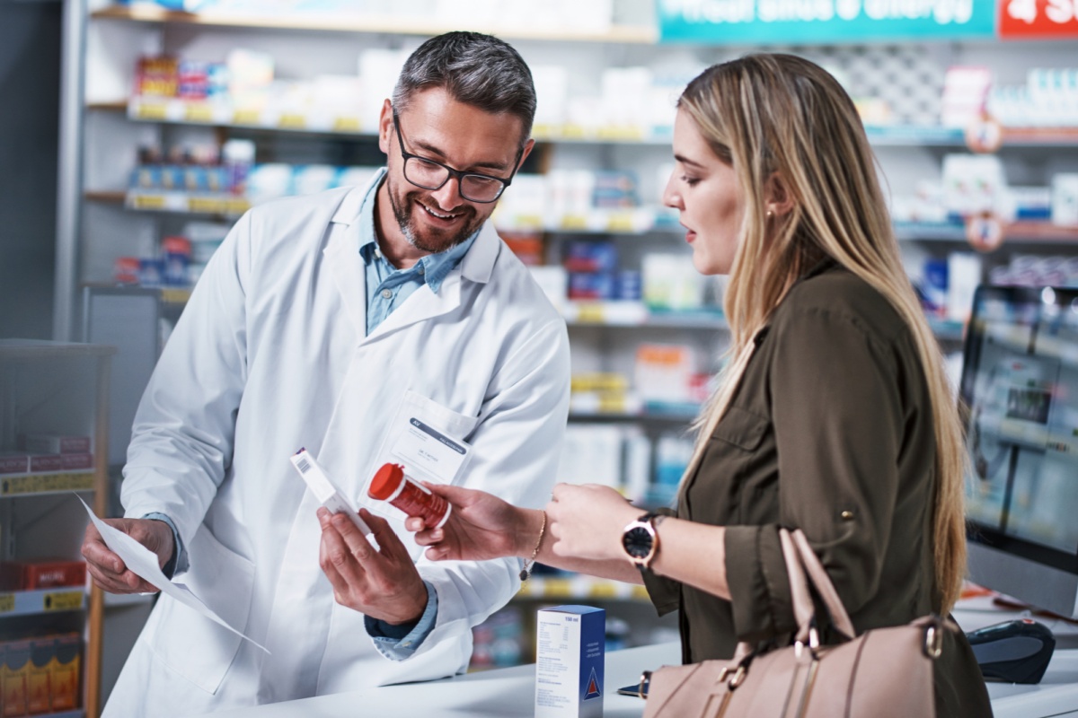 woman gets prescription cost help from pharmacist