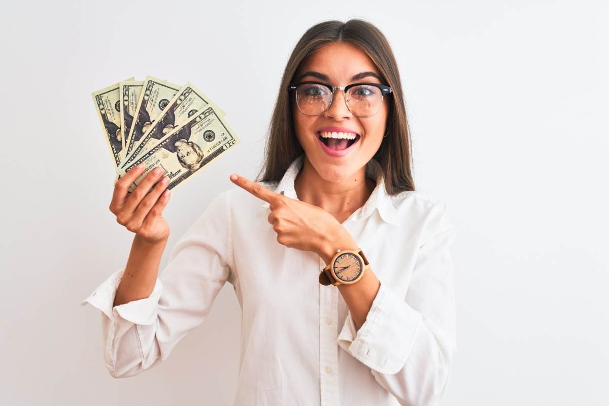 woman holding money from Nevada loan