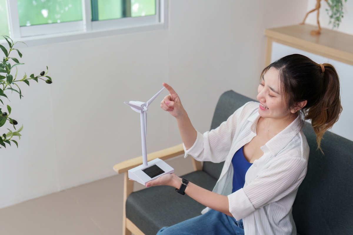 woman with small turbine for wind upgrades in Florida