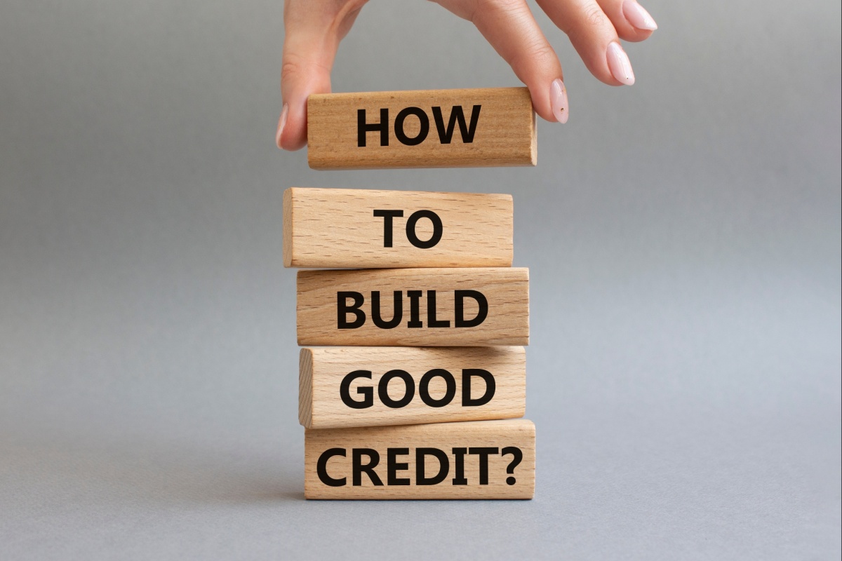 wooden blocks that say "how to build good credit"