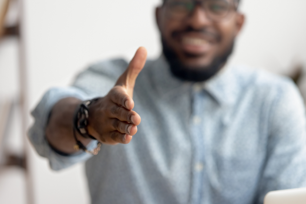 loan representative shaking hand for title loan