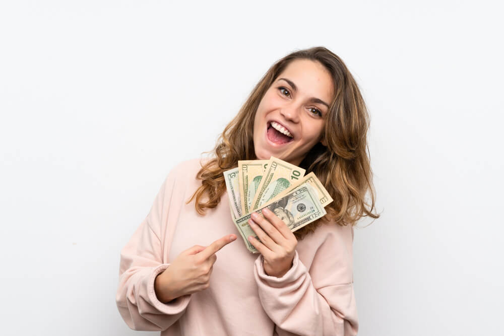 woman excited about her payday advance cash