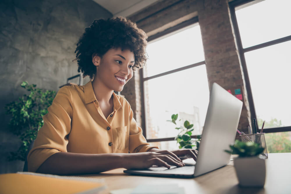 woman on laptop applying for registration loan